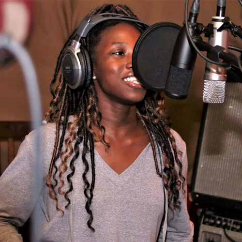 young-woman-singing-professional-studio